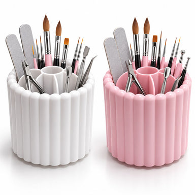 White and pink rotating nail art brush holders filled with brushes and files