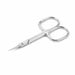 Silver precision cuticle scissors with fine pointed blades on a light gray background