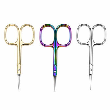 Gold, rainbow and silver precision cuticle scissors arranged side by side on a light gray background