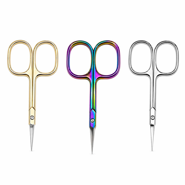 Gold, rainbow and silver precision cuticle scissors arranged side by side on a light gray background