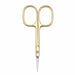 Gold precision cuticle scissors with fine pointed blades on a light gray background