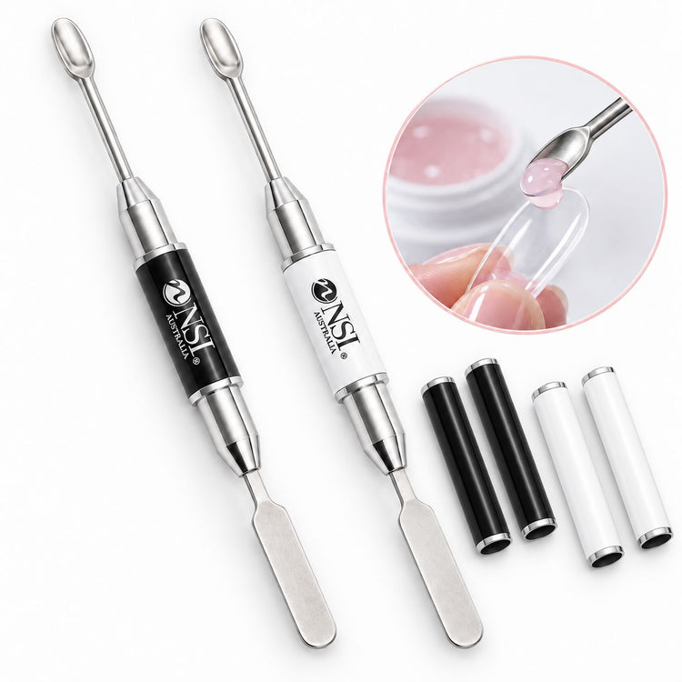 Black and white NSI double-ended gel scooping wands with spatula ends and matching caps, shown placing pink gel into a clear nail form.