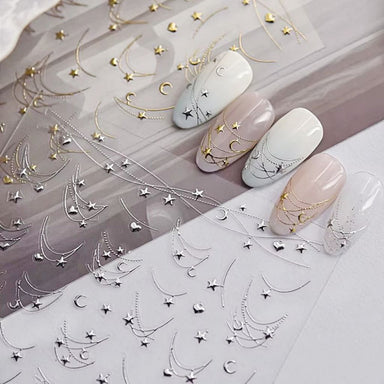 Star Moon and Heart Nail Art Sticker sheets with gold and silver celestial chain designs on manicure samples