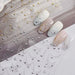 Star Moon and Heart Nail Art Sticker sheets with gold and silver celestial chain designs on manicure samples