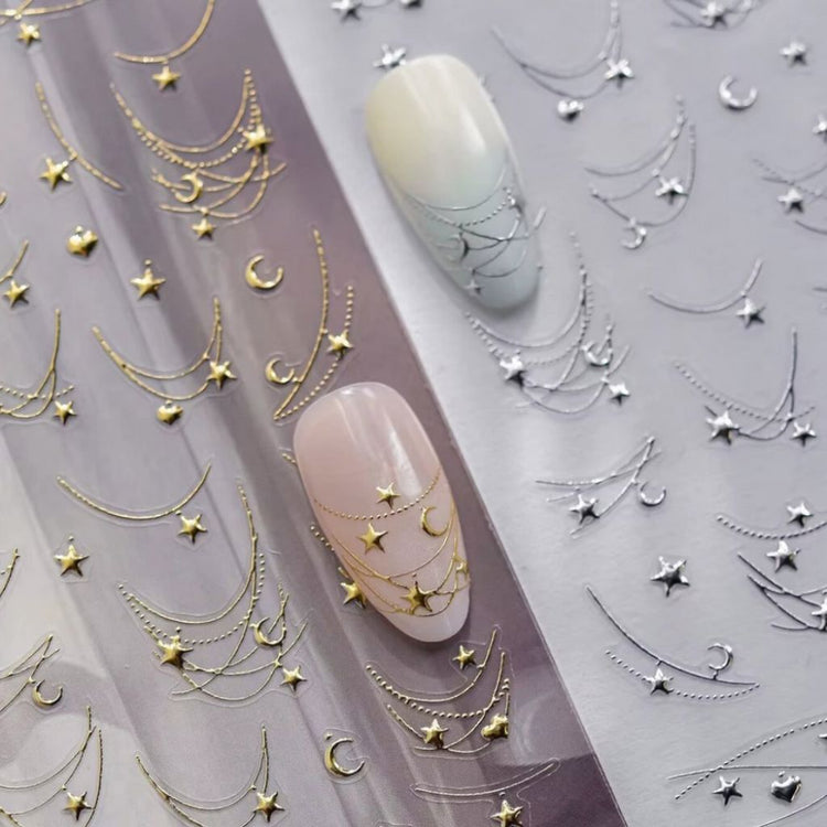 Star Moon and Heart Nail Art Sticker 2 colour pack with gold and silver celestial chain designs on nail samples