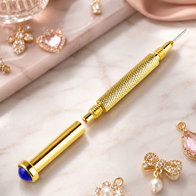 Gold stud drill nail piercing tool with blue gemstone cap and dangle charms for creating pierced nail art designs