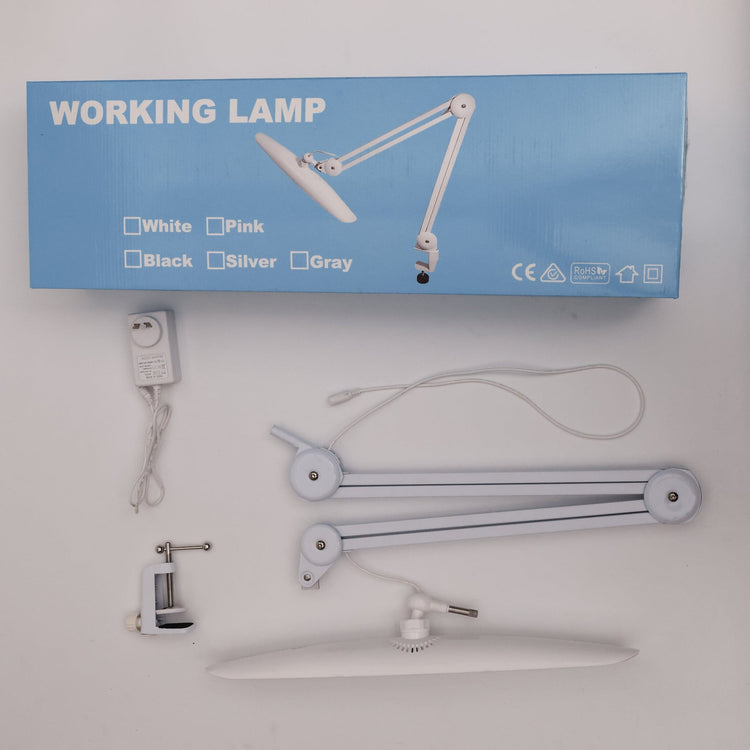 Nail Success Australia StudioFlex nail desk lamp kit — LED panel head, adjustable arm, desk clamp and power adapter beside blue box
