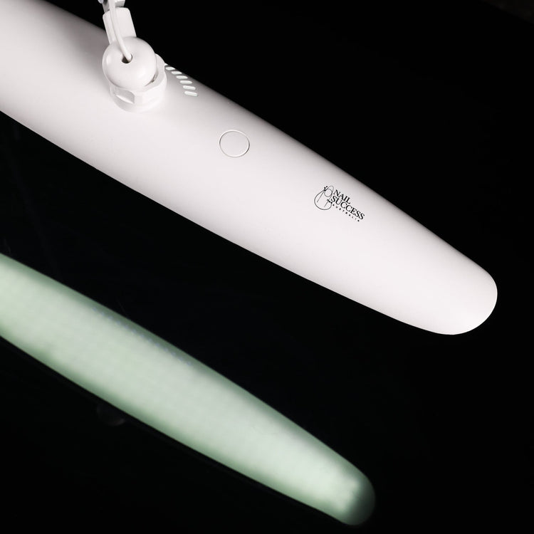 Nail Success Australia StudioFlex LED nail desk lamp close-up — slim white panel with touch power button and logo