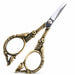 Bronze stylish bird nail scissors shown from side angle with open blades and ornate bird floral handles, NSI Australia