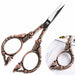 Copper stylish bird nail scissors close-up with sharp blades and ornate bird floral handles, NSI Australia