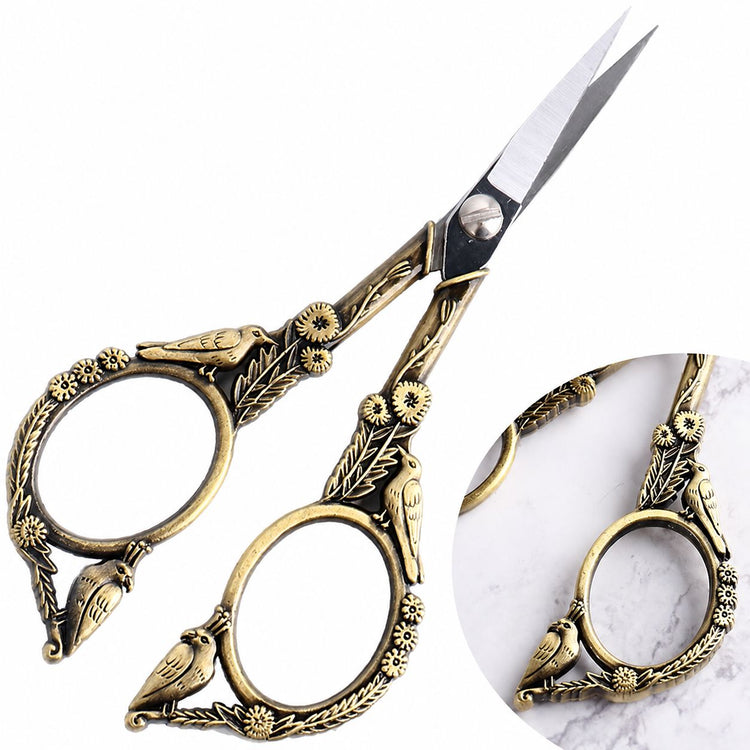 Bronze stylish bird nail scissors close-up with antique gold-tone finish, sharp blades and ornate bird floral detailing, NSI Australia