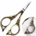Bronze stylish bird nail scissors close-up with antique gold-tone finish, sharp blades and ornate bird floral detailing, NSI Australia