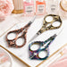 Copper, gold and rainbow stylish bird nail scissors displayed with Nail Success manicure products and salon accessories, NSI Australia