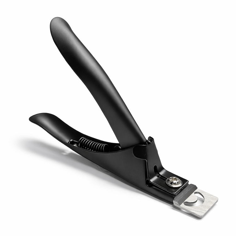 Black nail tip cutter with spring-loaded handle and silver cutting blade on a plain background