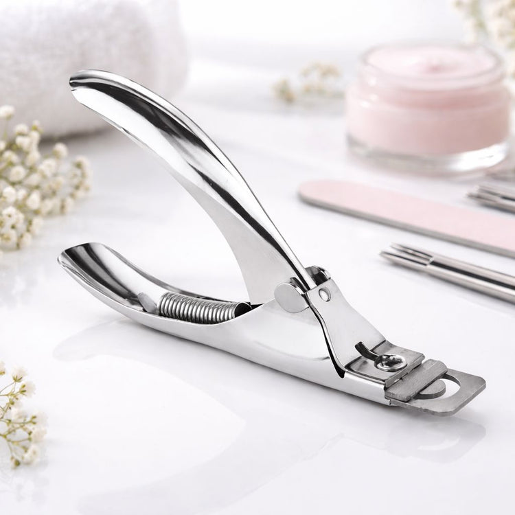 Three cuticle nippers in rose gold, rainbow and stainless steel finishes displayed side by side on a plain background