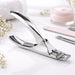 Three cuticle nippers in rose gold, rainbow and stainless steel finishes displayed side by side on a plain background