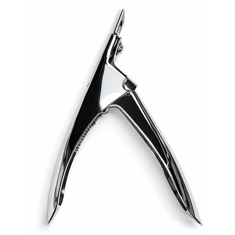 Back side view of stainless steel nail tip cutter with spring-loaded handle for artificial nail tip trimming
