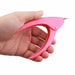 Pink PVC handle nail tip cutter held in hand for trimming artificial nail tips