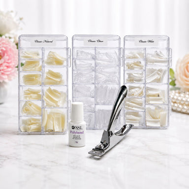 Classic square nail tips tipping pack with natural, clear and white half well ABS tips, Polybond nail glue and tip cutter on salon marble background