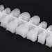 Clear NSI toe nail tips stacked in rows, close up