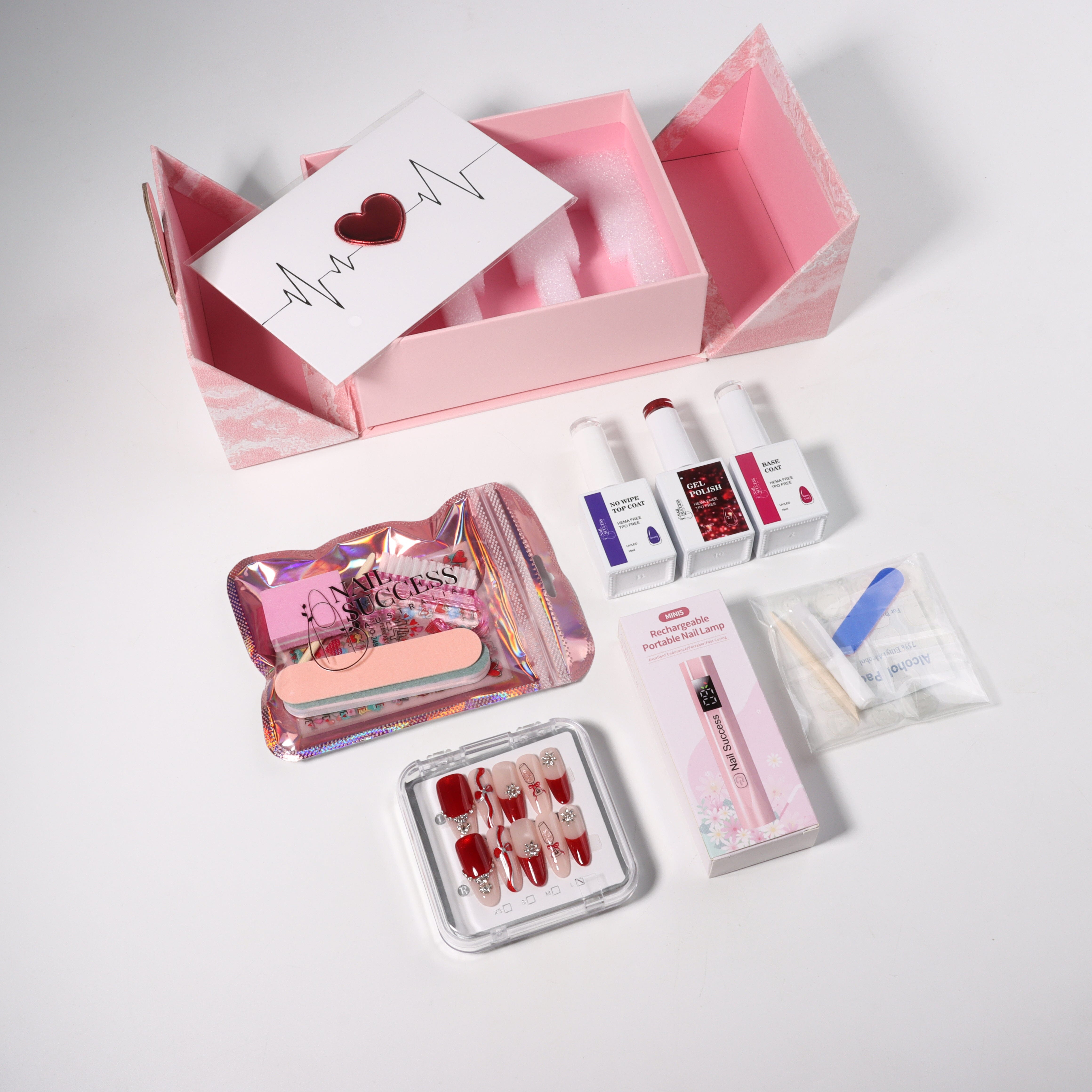 Nail Success Australia Valentine’s nail gift box with HEMA-free gel polish trio (base coat + colour + no-wipe top coat), mini rechargeable nail lamp, press-on nails and manicure tools