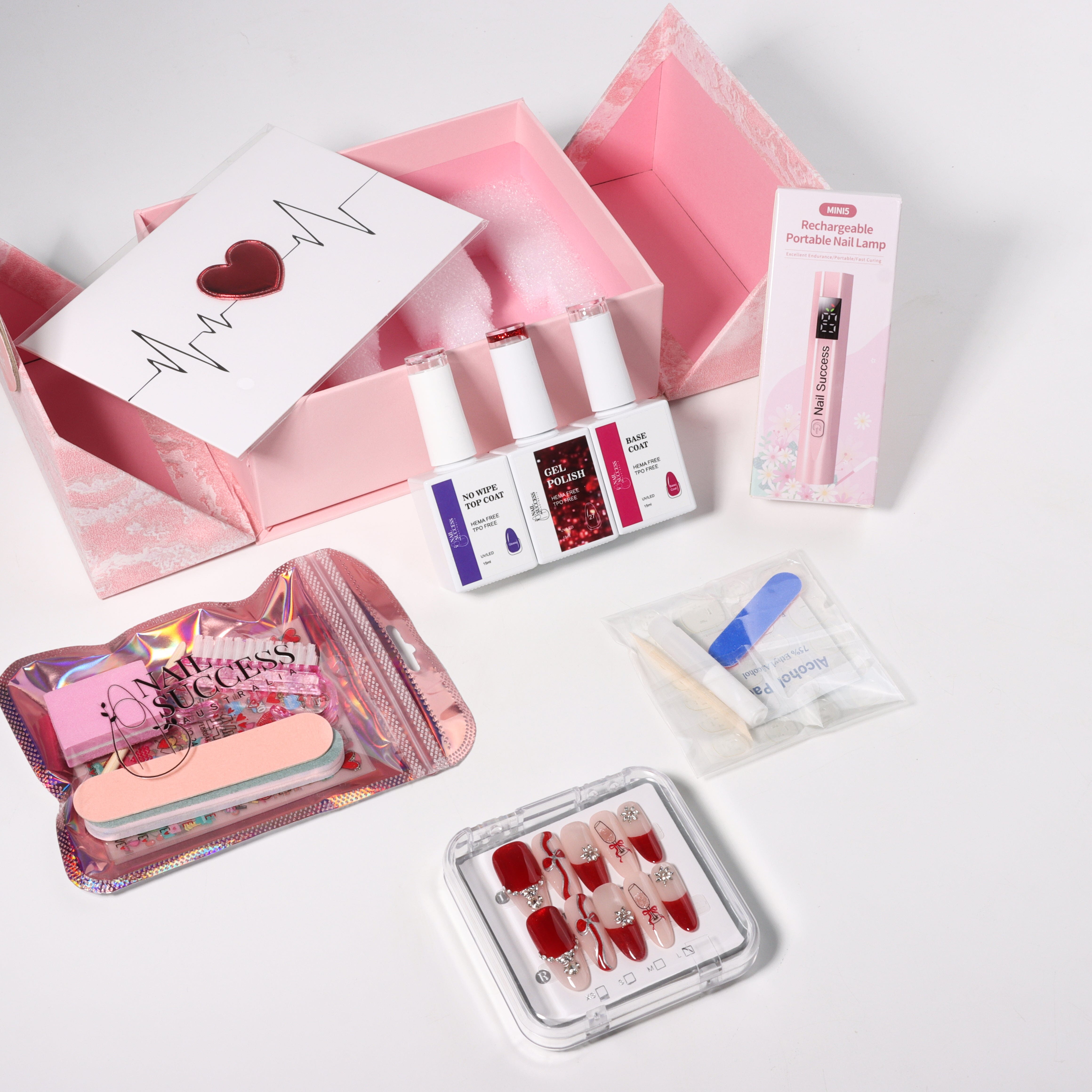 Valentine’s nail gift box set with gel polish, base coat and no-wipe top coat, mini rechargeable nail lamp, tools, rhinestones and red press-on nails