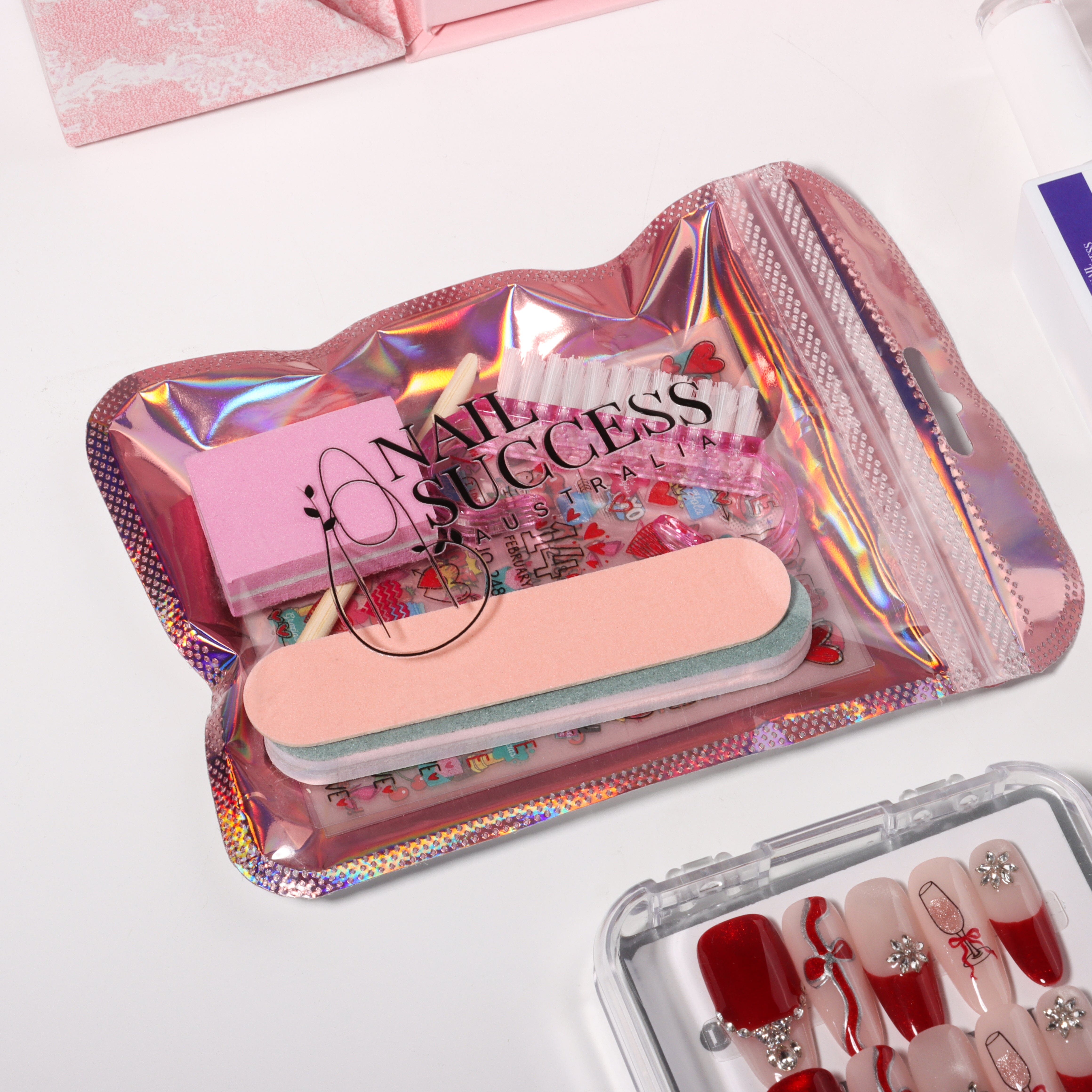 Nail Success Australia holographic nail care pouch with buffer block, nail file, cuticle stick and nail art stickers