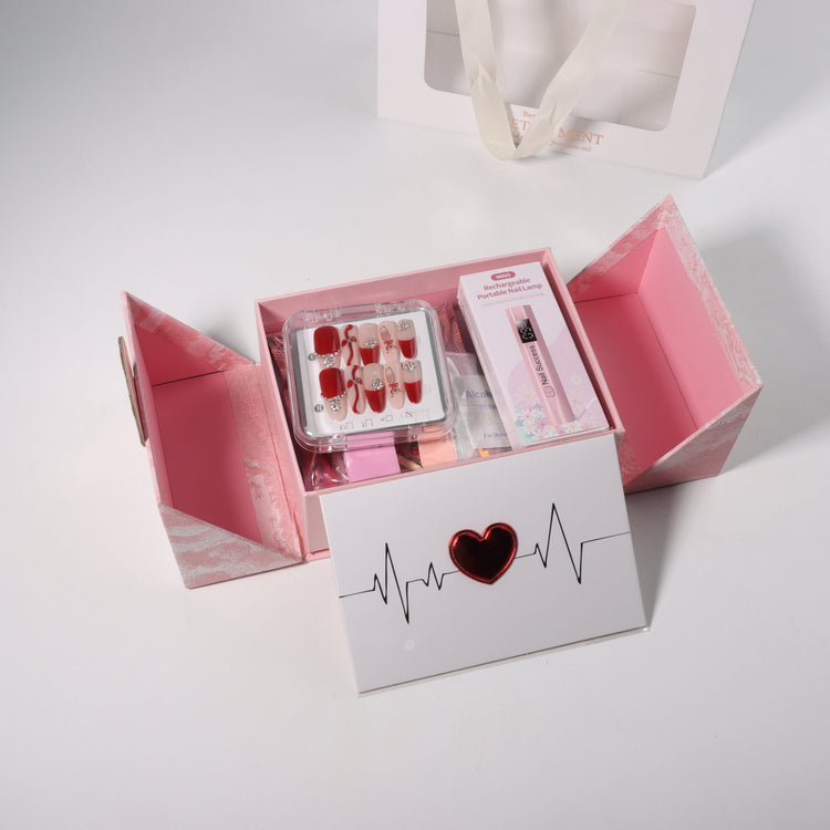 Nail Success Australia Valentine’s nail gift box open with press-on nails and mini rechargeable portable nail lamp in pink packaging
