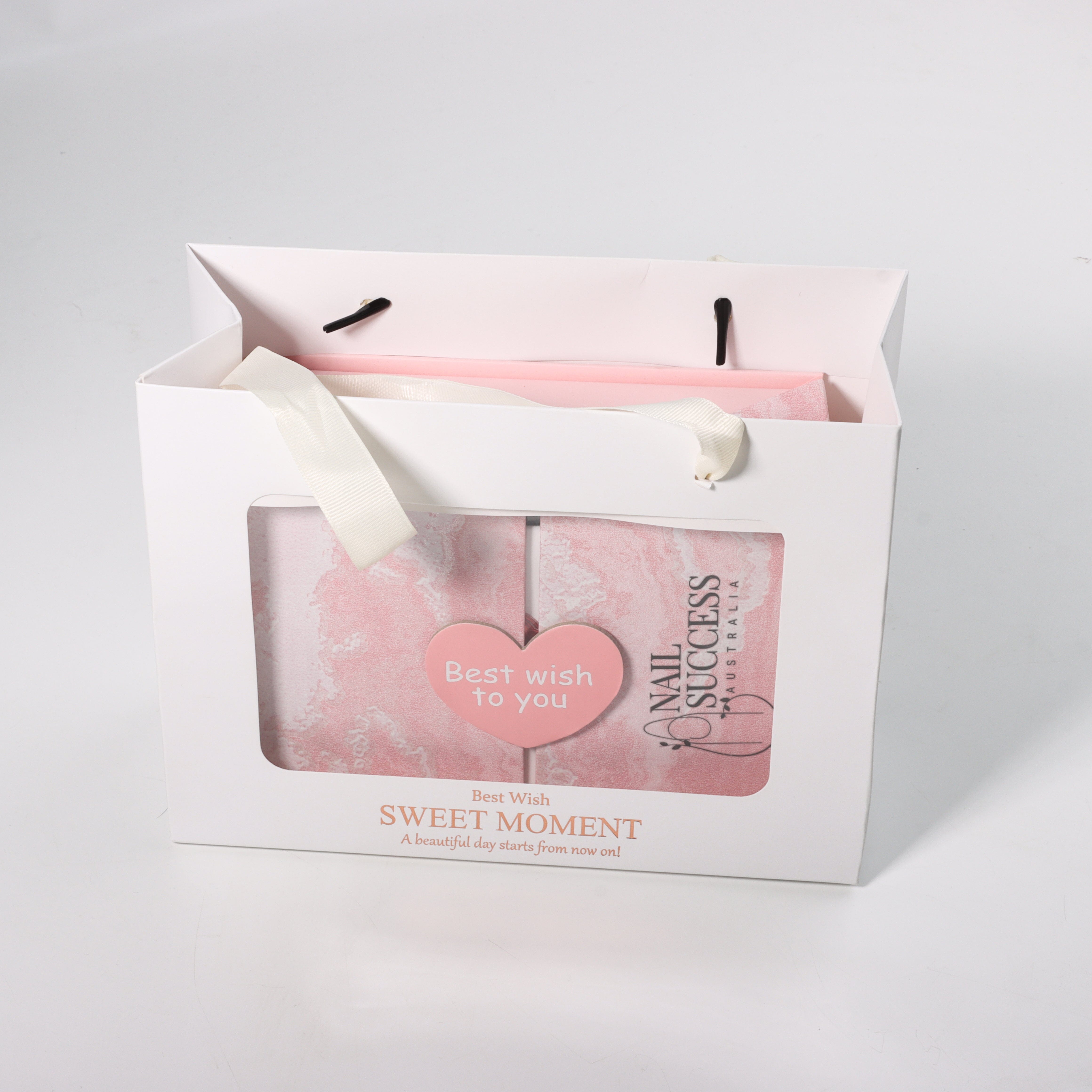Nail Success Australia Valentine’s nail gift box in white window gift bag with ribbon handles and “Best wish to you” heart tag