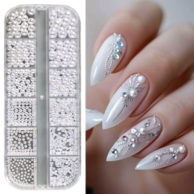 White pearl nail art decoration set with assorted round and half-round pearls and elegant stiletto manicure sample