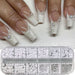White pearl nail art decoration set with assorted round and half-round pearls and French manicure sample