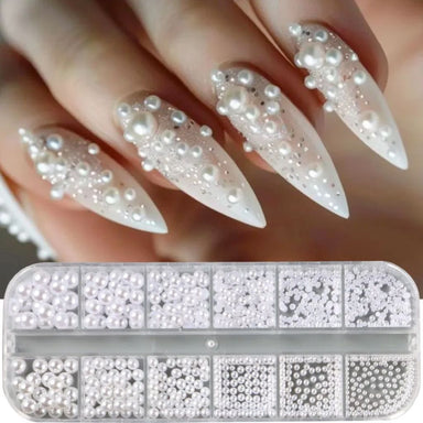 White pearl nail art decoration set with assorted round and half-round pearls and white stiletto manicure sample